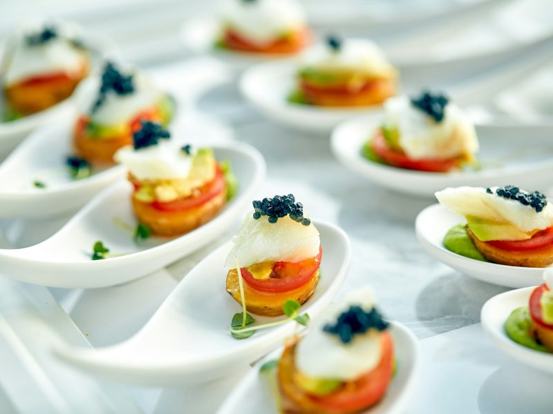 Delicious tartlets with black caviar. Concept of food, restaurant, catering, menu.