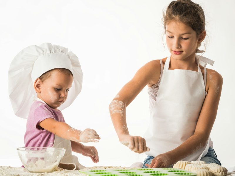 Little and cute kids brother and sister cook